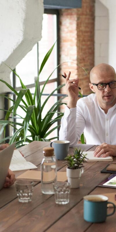 Man Wearing White Long-sleeved Shirt Holding Black Pen